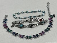 overall view of three bracelets laid flat