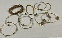 Overview of all gold-tone bracelets laid out