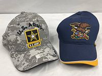 Front view of both caps displaying primary embroidery and colours