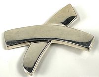 Front view of sterling silver X brooch