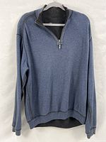 Front view of reversible quarter-zip pullover on hanger