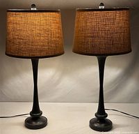 Both matching metal table lamps side by side