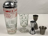 Full set showing shaker, Irish coffee glass and three jiggers
