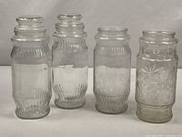 All four Mr. Peanut jars front view