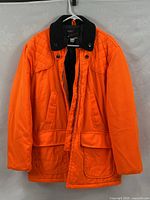 Full front view of blaze orange Sears hunting jacket