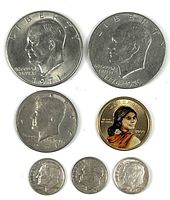 Obverse of all seven coins showing dates and portraits
