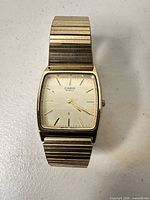 Front view of Casio MG-301G watch showing dial and bracelet