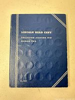 Closed blue Whitman folder front cover