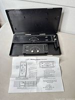 Entire set in open carrying case with instruction sheet visible