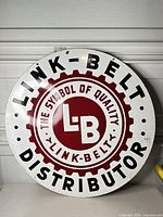 Front side of round Link-Belt porcelain sign showing full graphics