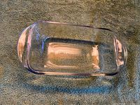 Top view showing entire clear glass loaf pan interior and handles