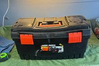 Front view of closed Black & Decker toolbox with latches visible