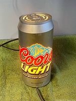 Front view showing illuminated Coors Light logo on can body