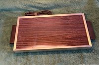 Top view of Devon electric warming tray showing wood-grain surface and cord