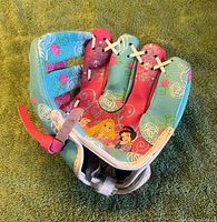 Open palm view showing Disney Princess graphics and overall condition