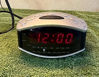 Front view showing LED display lit at 12:00 and tuner band markings