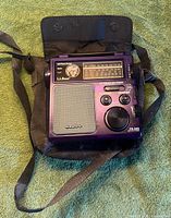 Front view of purple L.L. Bean FR-300 radio in shoulder bag