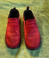 Top view of both red suede slip-on shoes