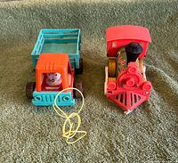 Front view of both pull toys showing overall design and colors