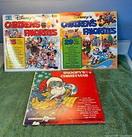 Front covers of all three records displayed