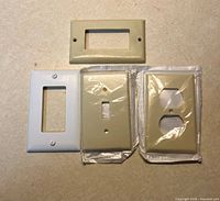 Front view of four wall plates showing types and colors