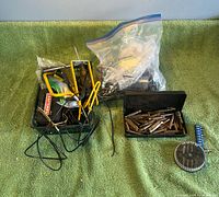 Overview of basket with tools, open bit case and fastener bag