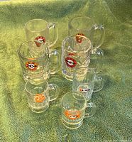 All seven A&W Root Beer mugs, assorted sizes