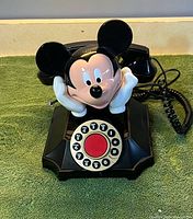 Front view showing Mickey figure, rotary-style touchtone dial and handset