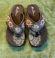 Front top view of pair showing embellishments and footbed design