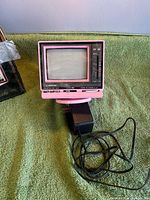 Front view of pink Nippon TV-422 showing screen and control panel