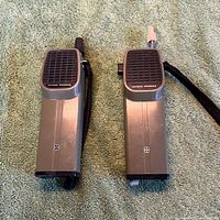 Front view of both National Panasonic walkie-talkies showing speaker grilles and antennas