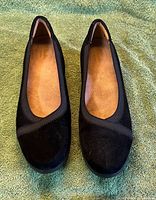 Front view of both shoes showing suede uppers and toe shape