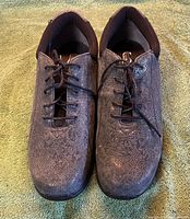 Top view of both shoes showing laces, pattern, and wear