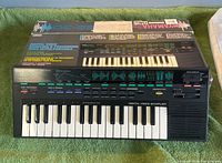 Keyboard front on original box top showing controls and keys
