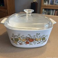 Front view of casserole with lid showing Spice of Life motif