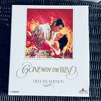 Front of white Deluxe Edition slipcase with cover art and title