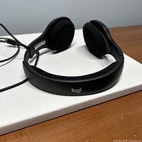 Headset side view showing headband and logo