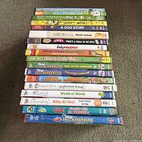Stack of 18 DVDs showing most titles on spines