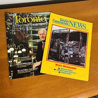 Both magazine fronts side by side on tabletop