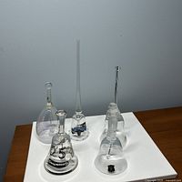 Group shot of all five clear glass/crystal bells