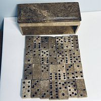 Domino tiles laid out with lid beside box