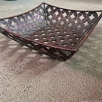 angled side view showing square shape and perforated design