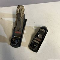 Top view of two cast iron hand planes, showing relative sizes and brand markings