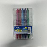 Front view of Pilot FriXion Clicker pack showing five pens and label indicating 7-pack