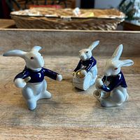Overview of all three rabbit musician figurines