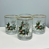 Set of four Portmeirion Holly & Ivy tumblers showing design and gold rims