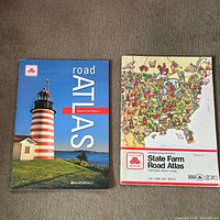 Front covers of both Rand McNally State Farm road atlases