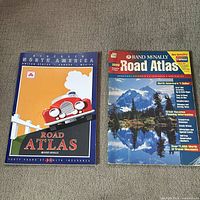 Front covers of both atlases