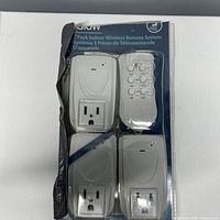 Front of open-box package showing three receivers and remote