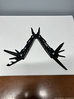 Multi-tool fully opened showing all implements